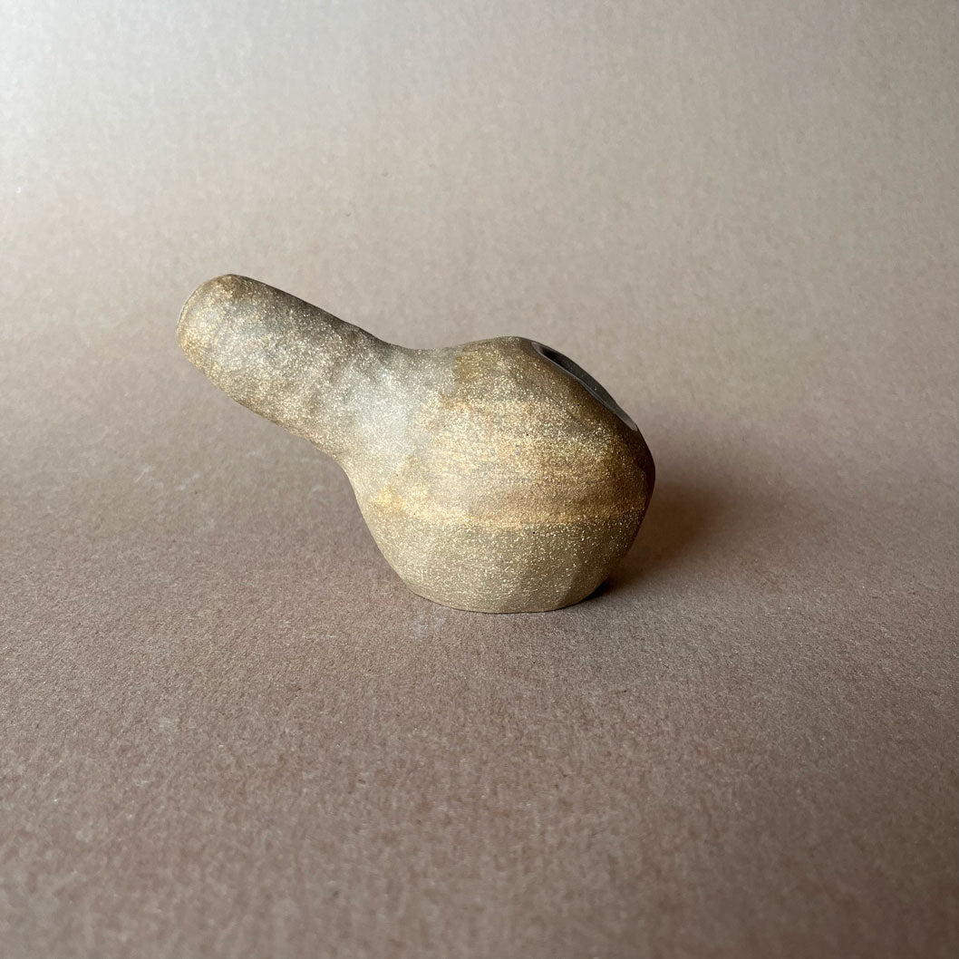 A gourd shaped, spherical body form in brown stoneware with hammered texture, featuring a large glazed inset bowl and rounded stem protrusion mouthpiece.