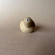 A gourd shaped, spherical body form in brown stoneware with hammered texture, featuring a large glazed inset bowl and rounded stem protrusion mouthpiece.
