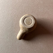 A gourd shaped, spherical body form in brown stoneware with hammered texture, featuring a large glazed inset bowl and rounded stem protrusion mouthpiece.