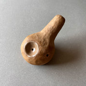 A gourd shaped, spherical body form in brown stoneware with hammered texture, featuring a large glazed inset bowl and rounded stem protrusion mouthpiece.