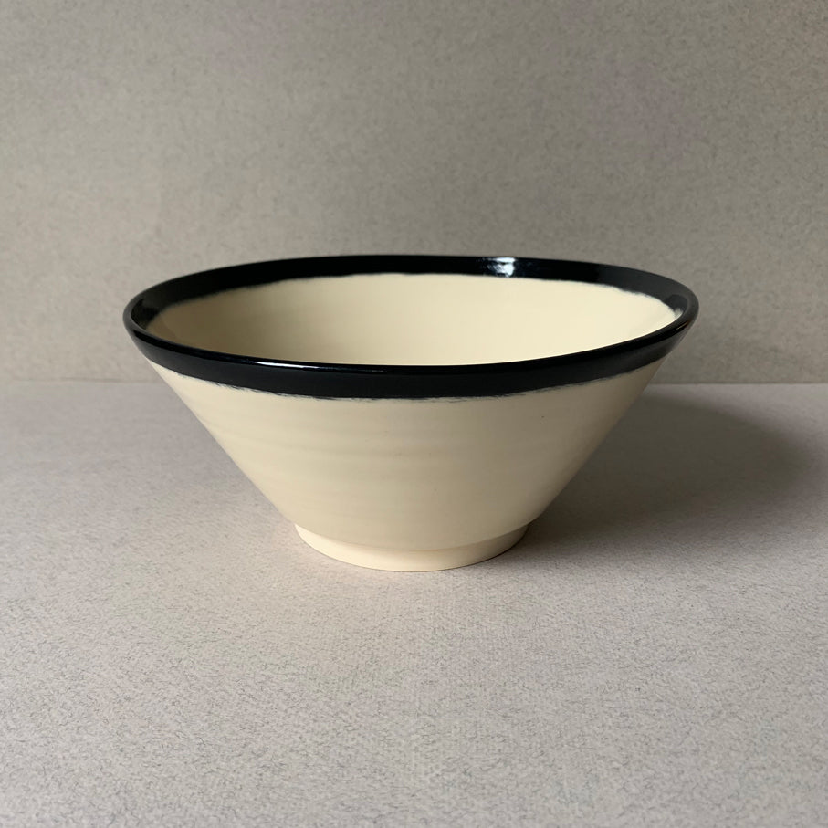 Black and white hand painted angled bowl, angled side view