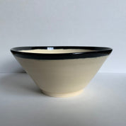 Black and white angled bowl, side view
