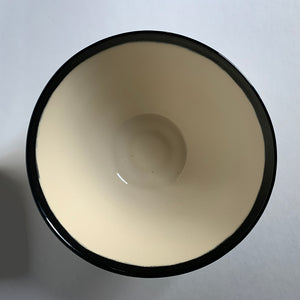 Black and white angled bowl, top view